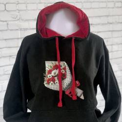 Perfect Gift Introducing our exclusive Olives & Poppies Hoodie. &nbsp;This beautiful black hoodie, has a striking red-lined hood and matching ties and is an embodiment of art, culture, and solidarity. The focal point of this unique hoodie is a captivating image featuring a delicate arrangement of poppies and olives wrapped in paper, adorned with a keffiyeh-inspired design. The rich symbolism of poppies and olives, coupled with the keffiyeh pattern, creates a visual narrative advocating for peace in solidarity with the people of Palestine. Available in sizes small - xxl N.B: As all apparel is printed in-house please allow up to 2 weeks for delivery. Should you need the items sooner, please contact us and we do our best to help you Insha Allah.