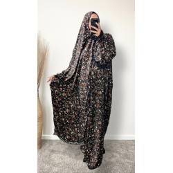 Perfect Gift One Size Only (52" - 64") fits UK sizes 8 to 24.   62-64”/160cm- Standard Length: The dress is designed to be long enough to cover your feet while praying Salah. If you would like to adjust the length, please click on the 'Tailored Length' option and specify your preferred length in the 'Order Notes' section at checkout, or email us, and we will confirm the change via email. You can refer to the size chart below to help you determine the suitable length  83cm - Width of dress : This refers to one side of the dress when laid flat, making the full circumference approximately 166cm. The dress is intentionally designed to be wide and oversized for a modest, full-coverage fit.  75cm - Sleeve length (from wrist to shoulder) Hijab Measurements: 210 cm (Length) x 60 cm (Width) Optional: You can choose to have the hijab attached or separate from the abaya Attached Hijab: The hijab will be attached with the short side on the right allowing the long side to be wrapped with your left hand.  If you prefer a right - handed wrapping arrangement, please add a note in the 'Order notes' section at checkout, or email us, and we will confirm the change via email. You must notify me within 24 hours before I proceed with sewing the custom attachment. Invisible side pockets Elastic cuff finished  Lace finish on the cuff and hijab   Material 100% Viscose  Colour - Black 